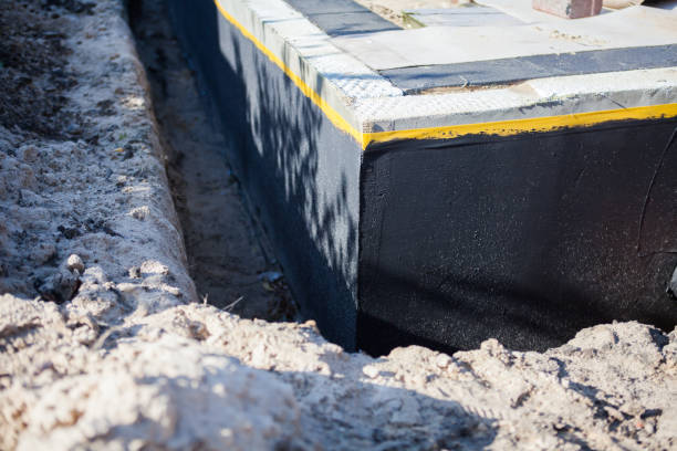 Professional Waterproofing technician working in Andrews, SC